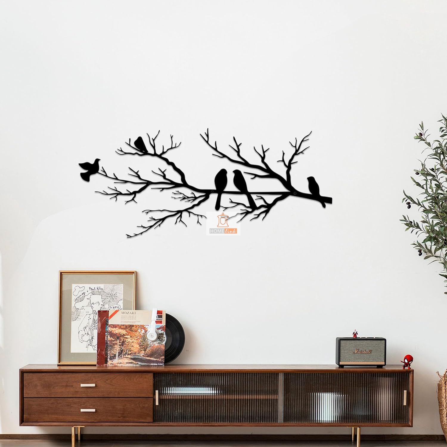 Bird decorations on metal wall art branches